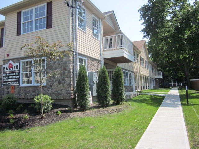 a building with a sidewalk in front of it