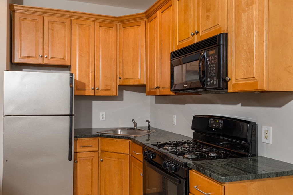 a kitchen with a stove microwave and refrigerator