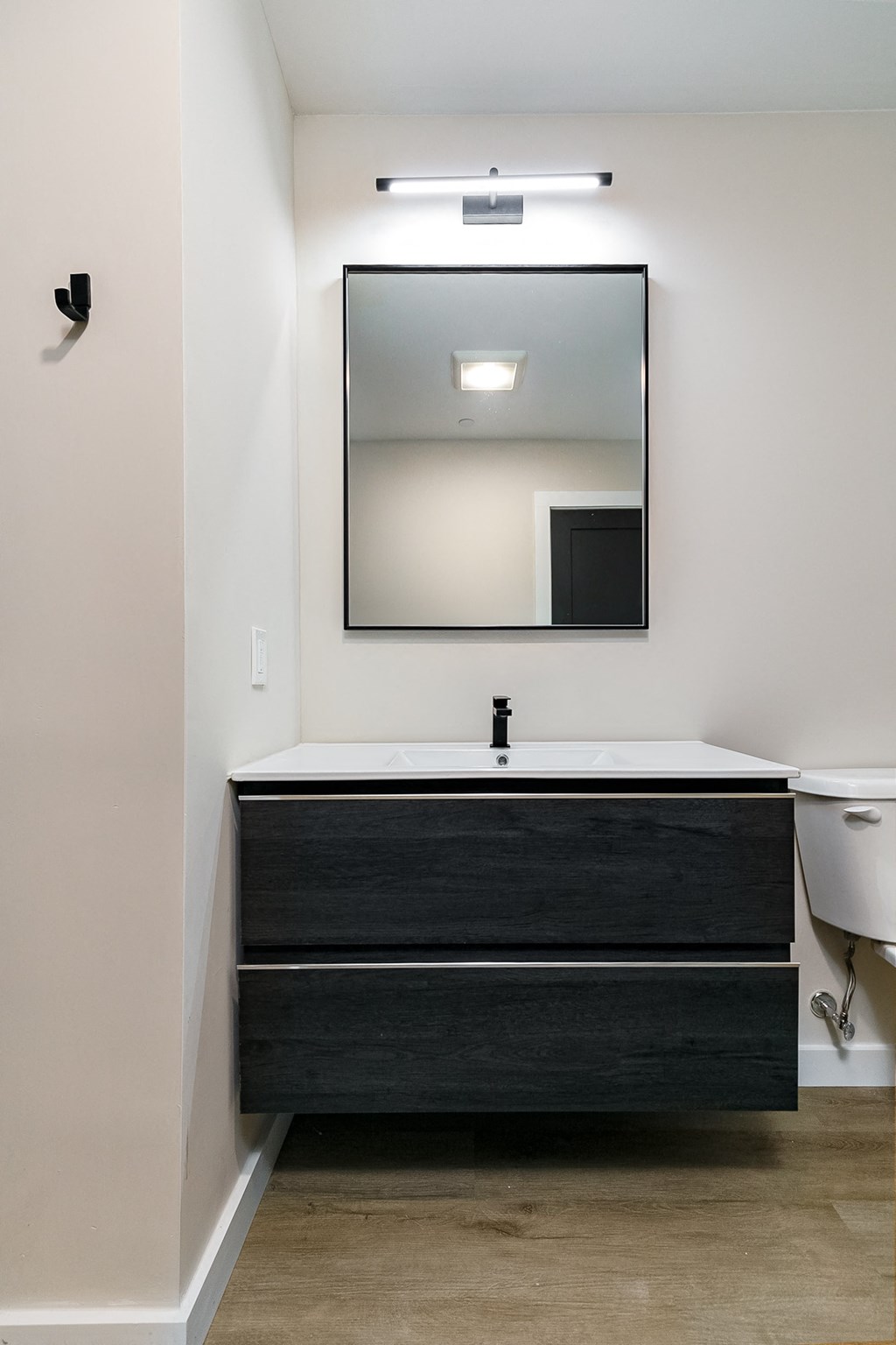 a modern bathroom with a sink and a mirror