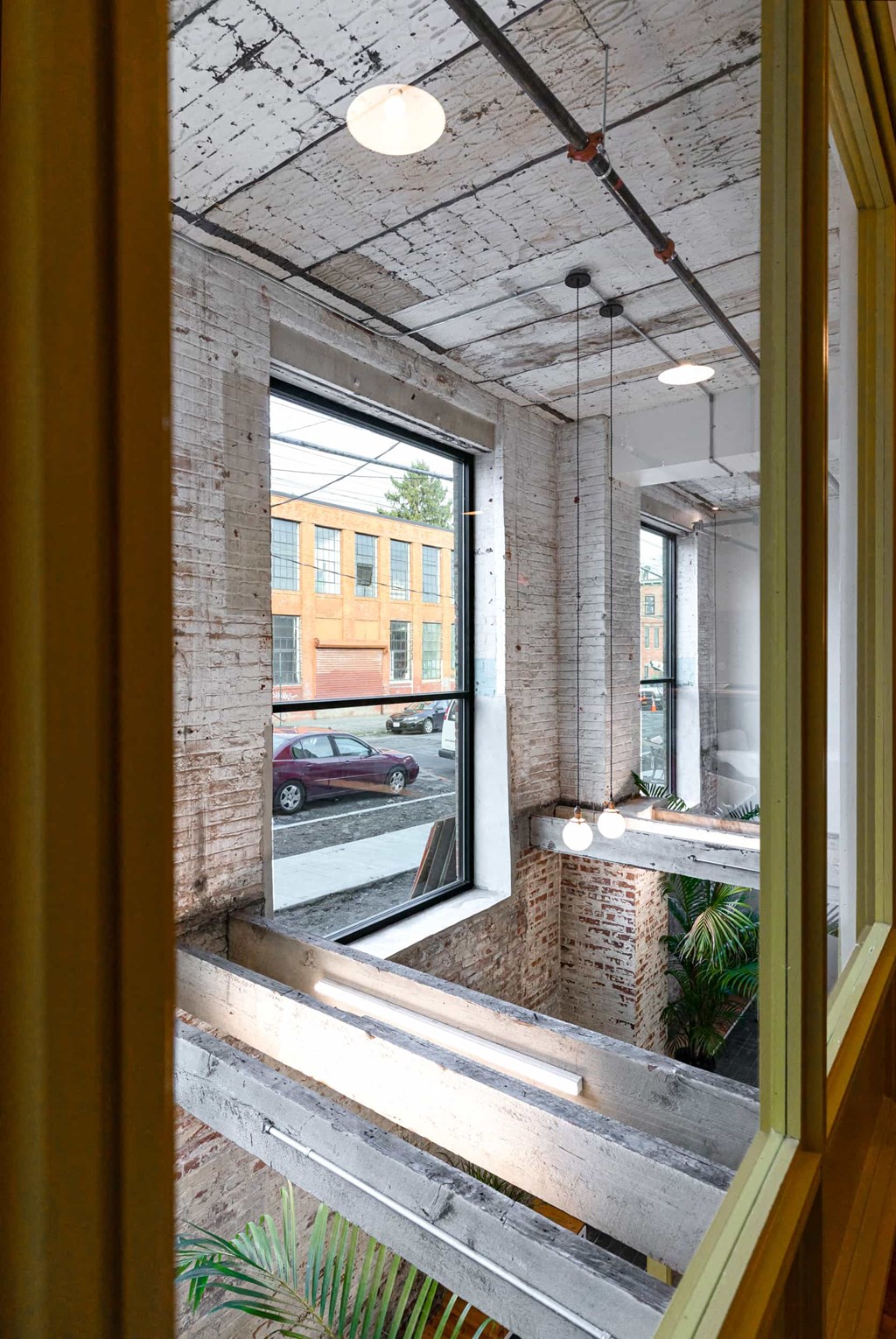 a large window in a building with a street view