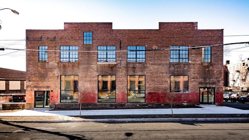 the facade of a brick building on a city street