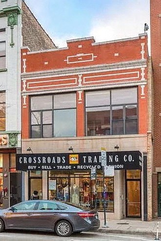 a car parked in front of a building
