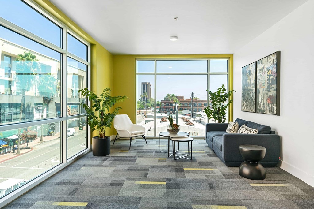 a living room with a couch and a large window