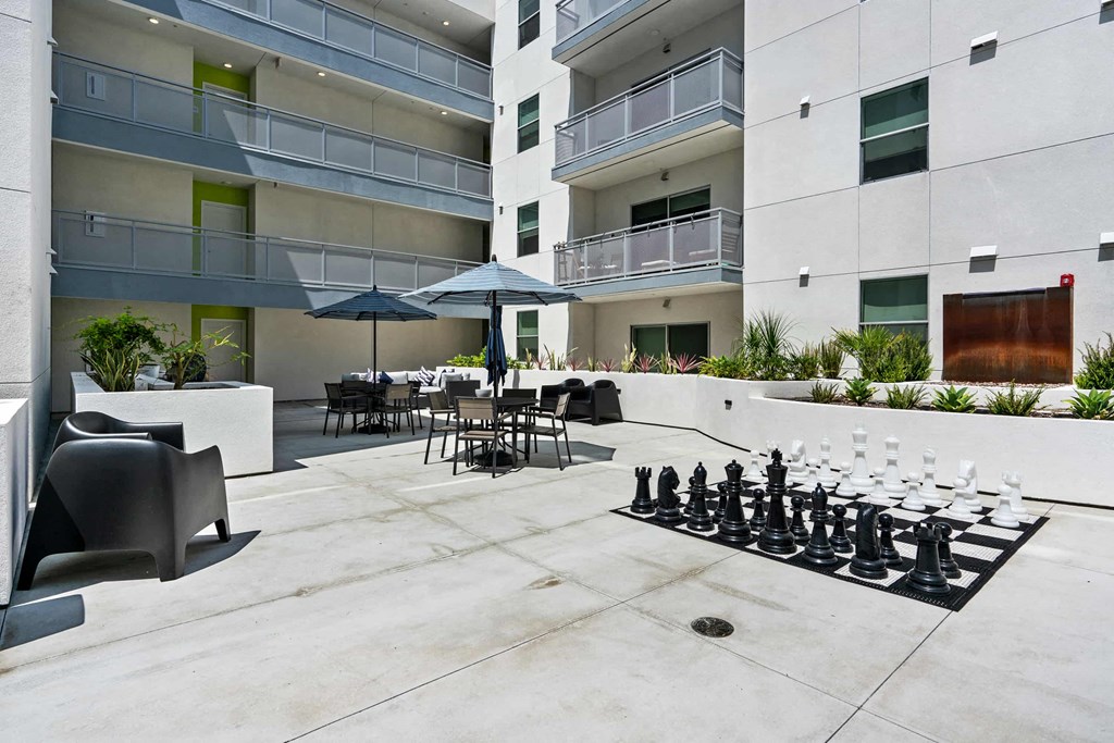 a chess set in front of an apartment building