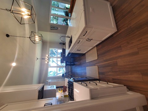a kitchen with a stove and a window