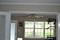 a room with a ceiling fan and a window