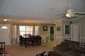 a large living room with a dining room and a table