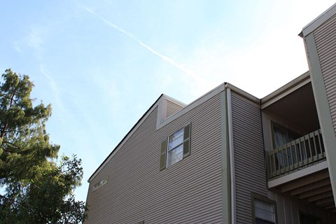 A building with a balcony and a window.