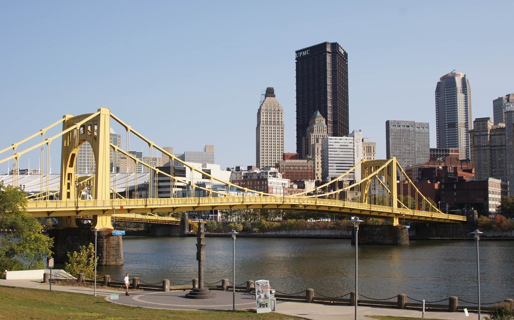 a view of the city and bridge over the river