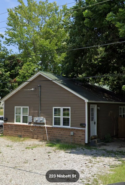 A house with the number 223 on it.