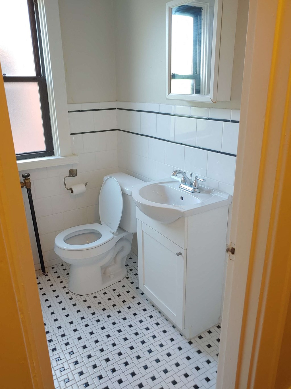 a bathroom with a toilet and a sink