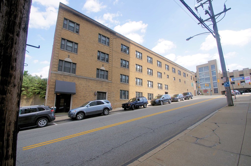 a large brick building on the side of a street