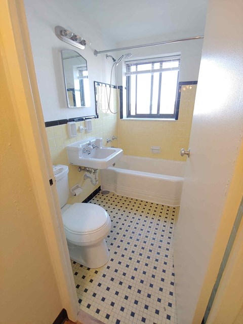 a bathroom with a toilet and a sink