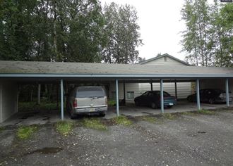 a car garage with a van parked in it