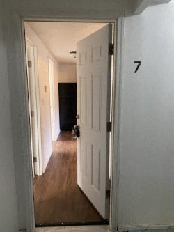 A hallway with a door numbered 7.