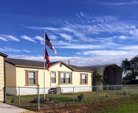 A house with a flag on the front.
