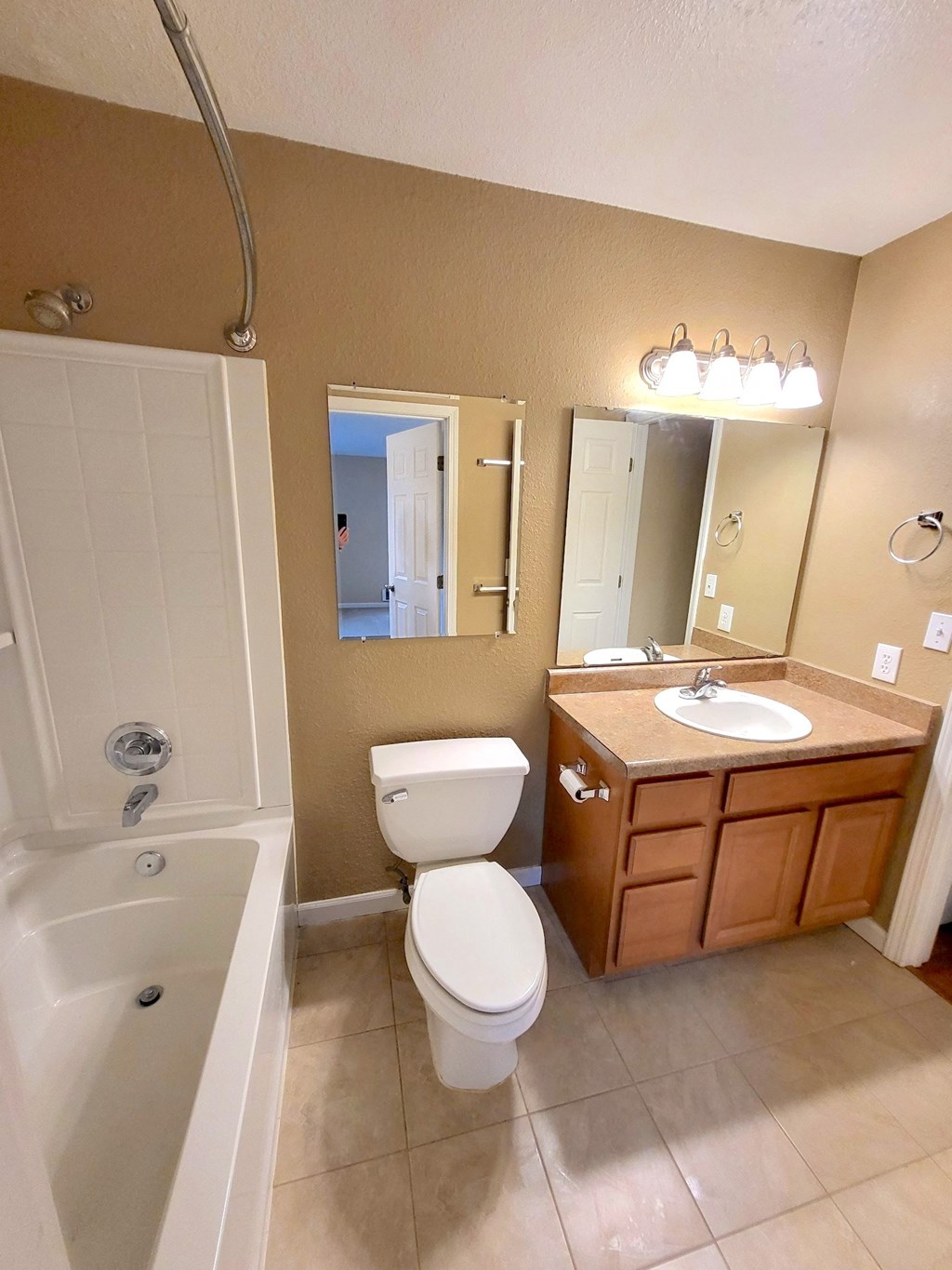 a bathroom with a toilet sink and bath tub