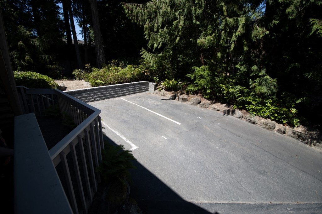 a parking lot at the top of a stairs