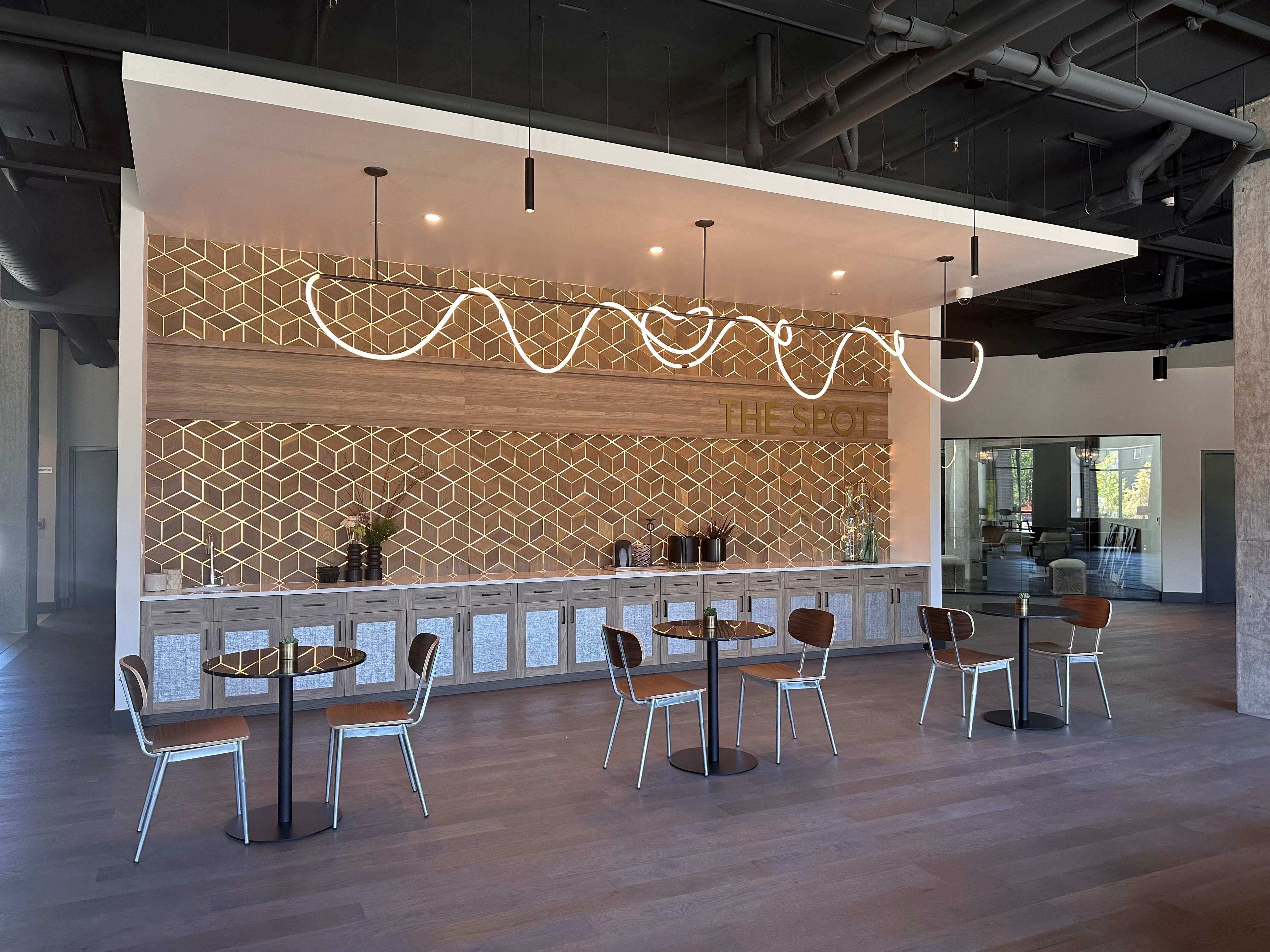 a restaurant with tables and chairs in a lobby