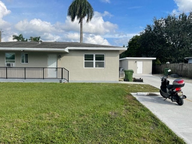 a motorcycle parked in a driveway in front of a house