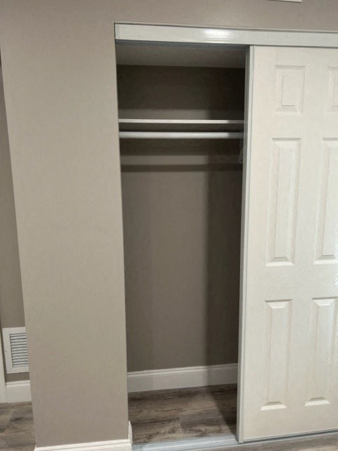 an empty closet with a white door