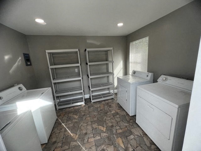 an empty laundry room with a bunch of white appliances