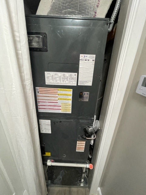 a furnace with stickers on it in a doorway