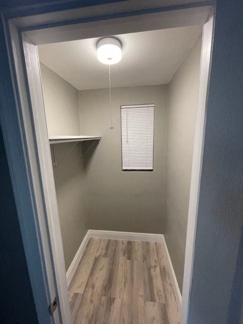 a empty room with a light hanging from the ceiling