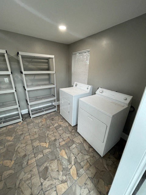a laundry room with two washes and a stack of shelves