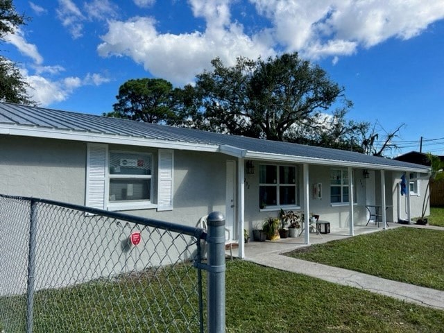 a house with a chain link fence in front of it
