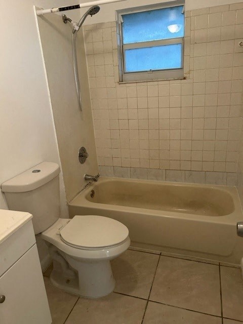 a bathroom with a toilet and a bath tub