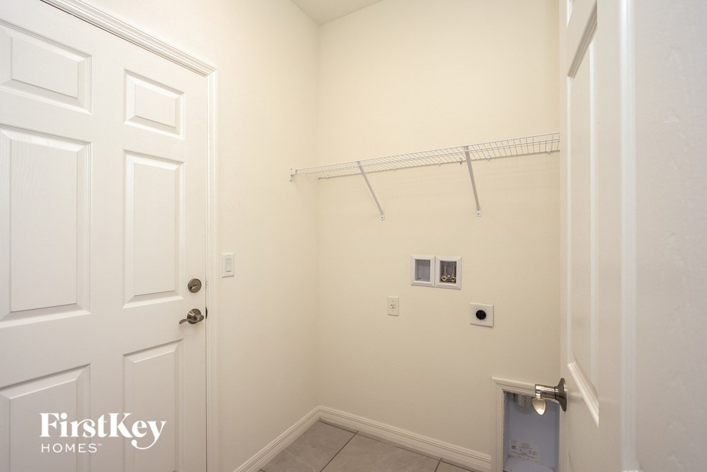 a small bathroom with a closet and a white door