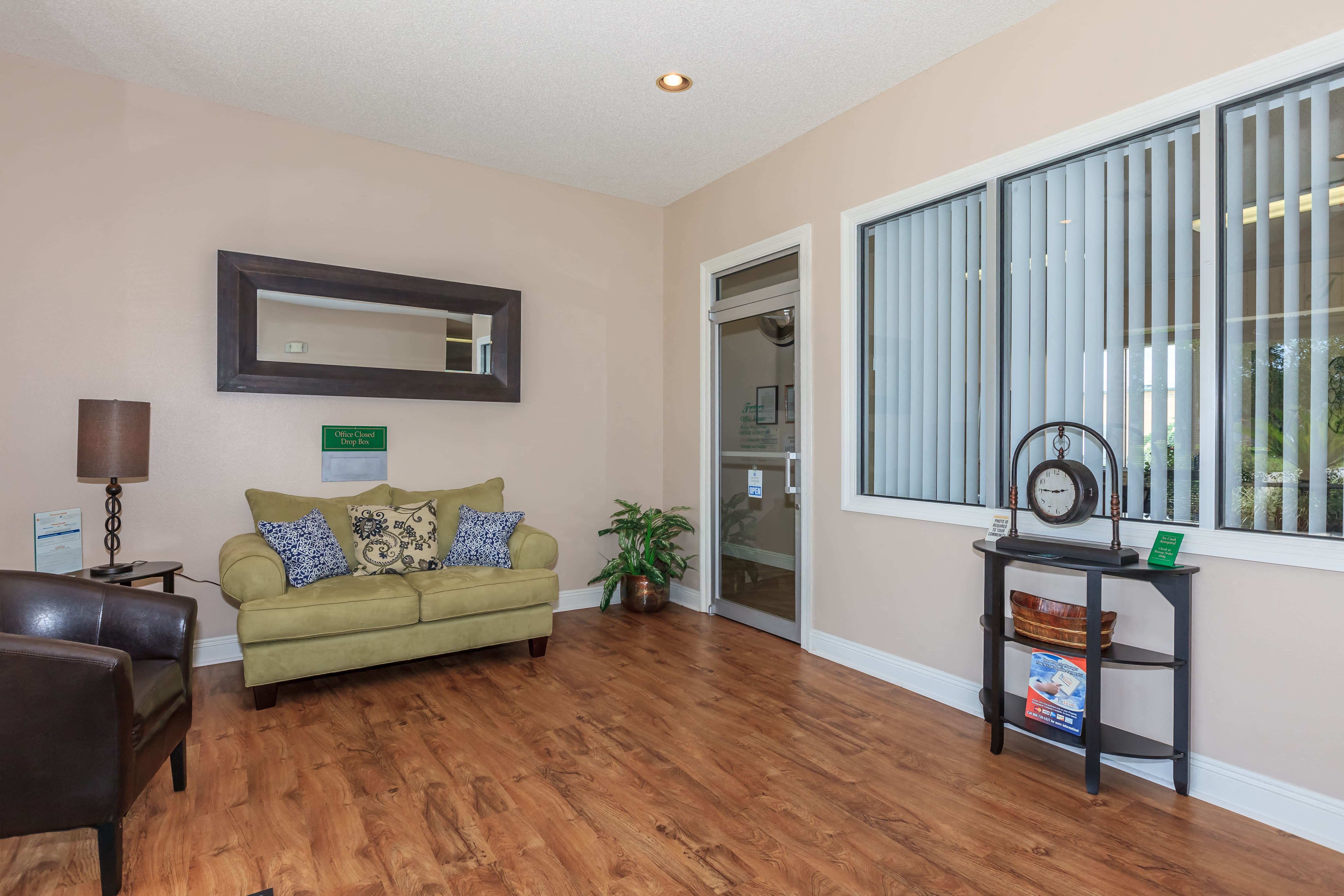 a living room with a couch and a window
