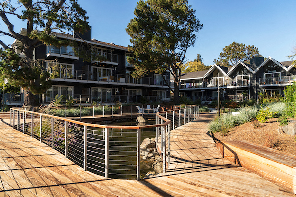 a wooden boardwalk in front of a building