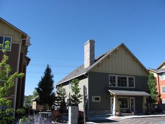 a view of the front of a house with a blue sky