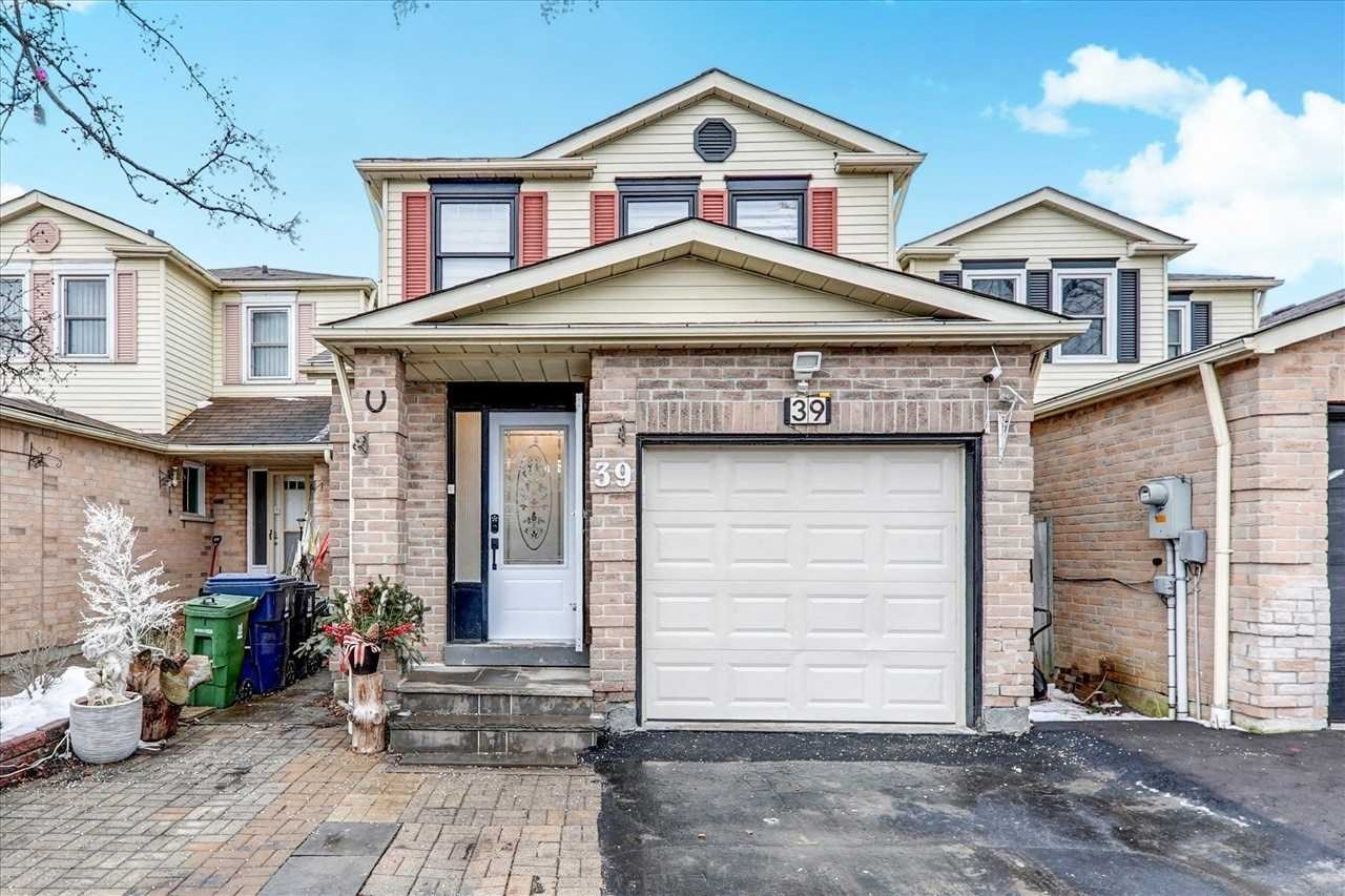 a brick house with a white garage door
