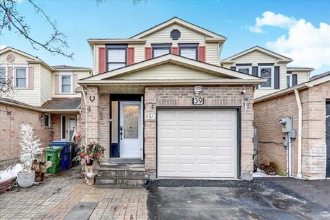 a brick house with a white garage door