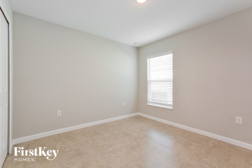 the living room of this home has been cleaned and is empty