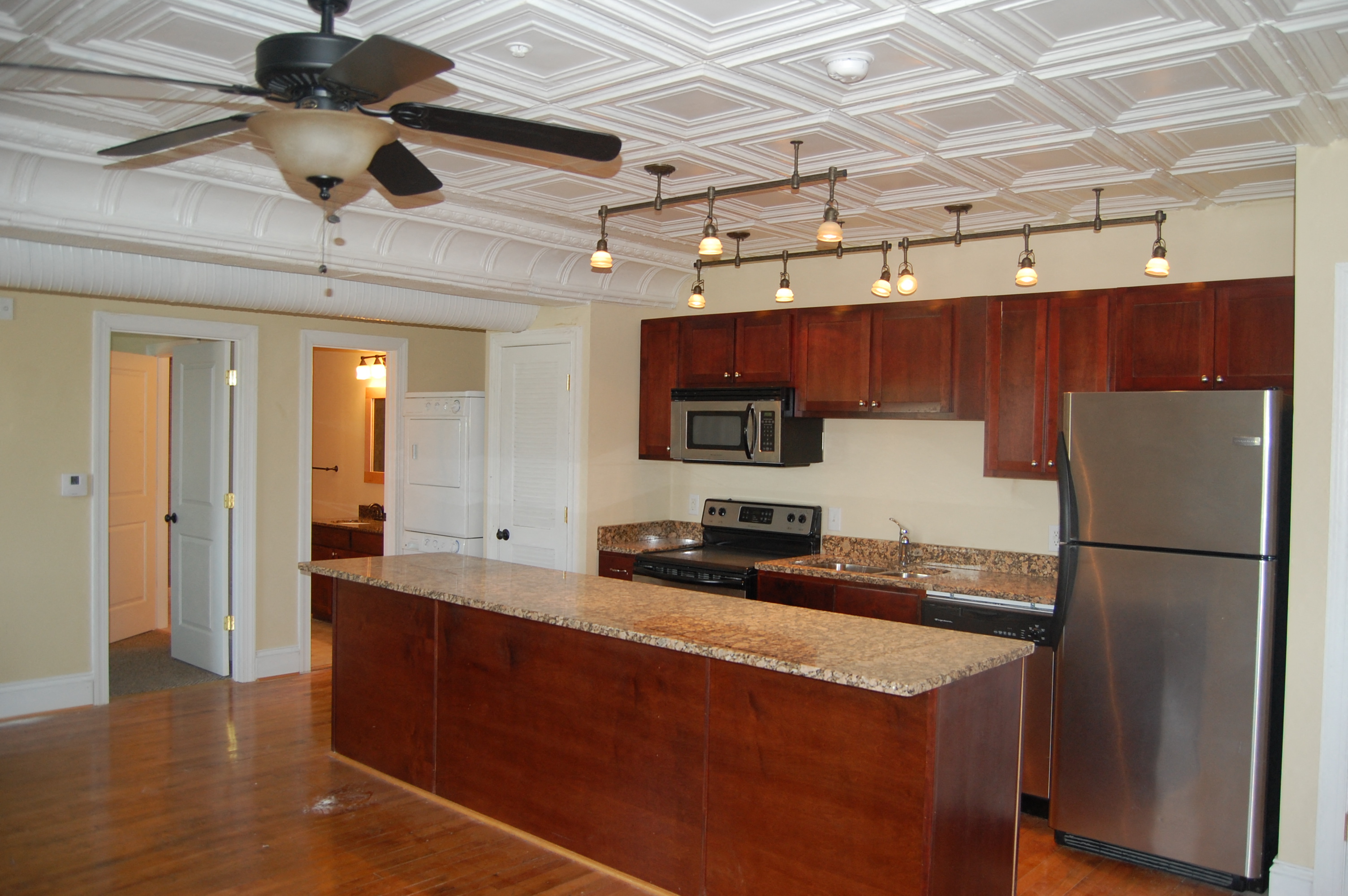 a kitchen with stainless steel appliances and a granite counter top