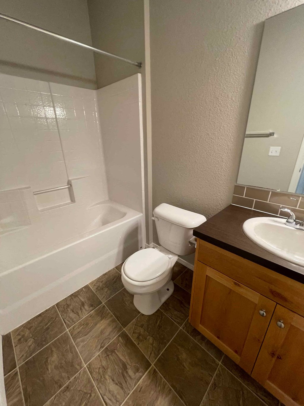 a bathroom with a sink toilet and a bath tub