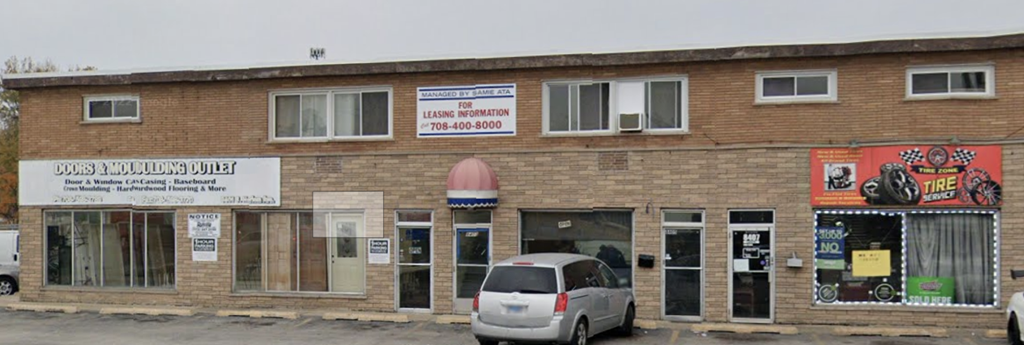 a building with a car parked in front of it