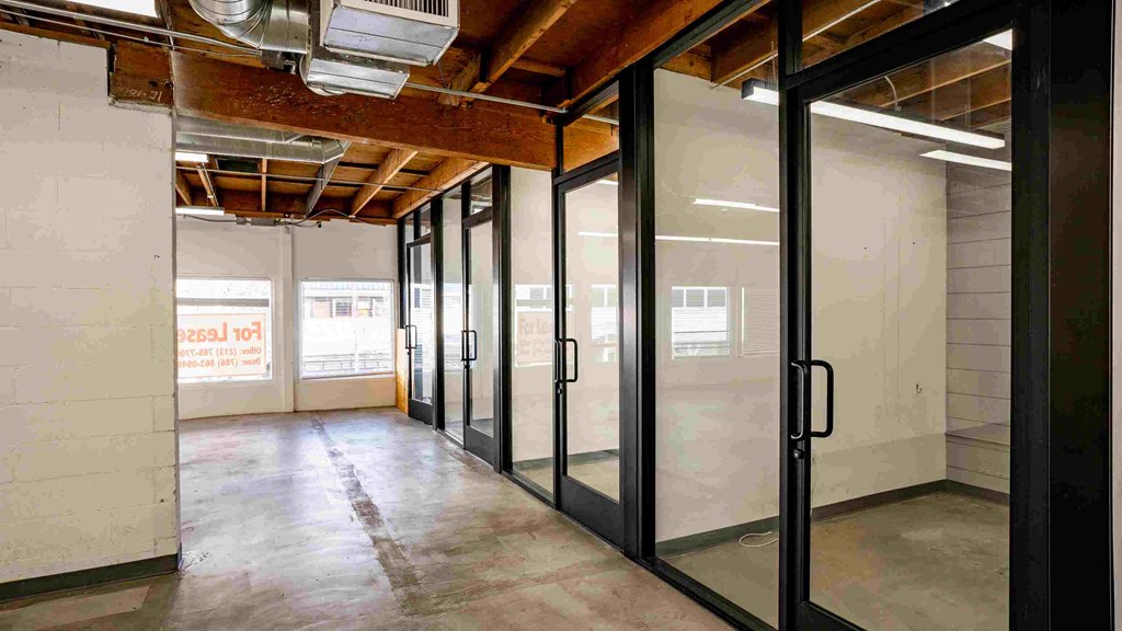 a large room with glass doors in a building