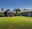 a house with a yard in front of it