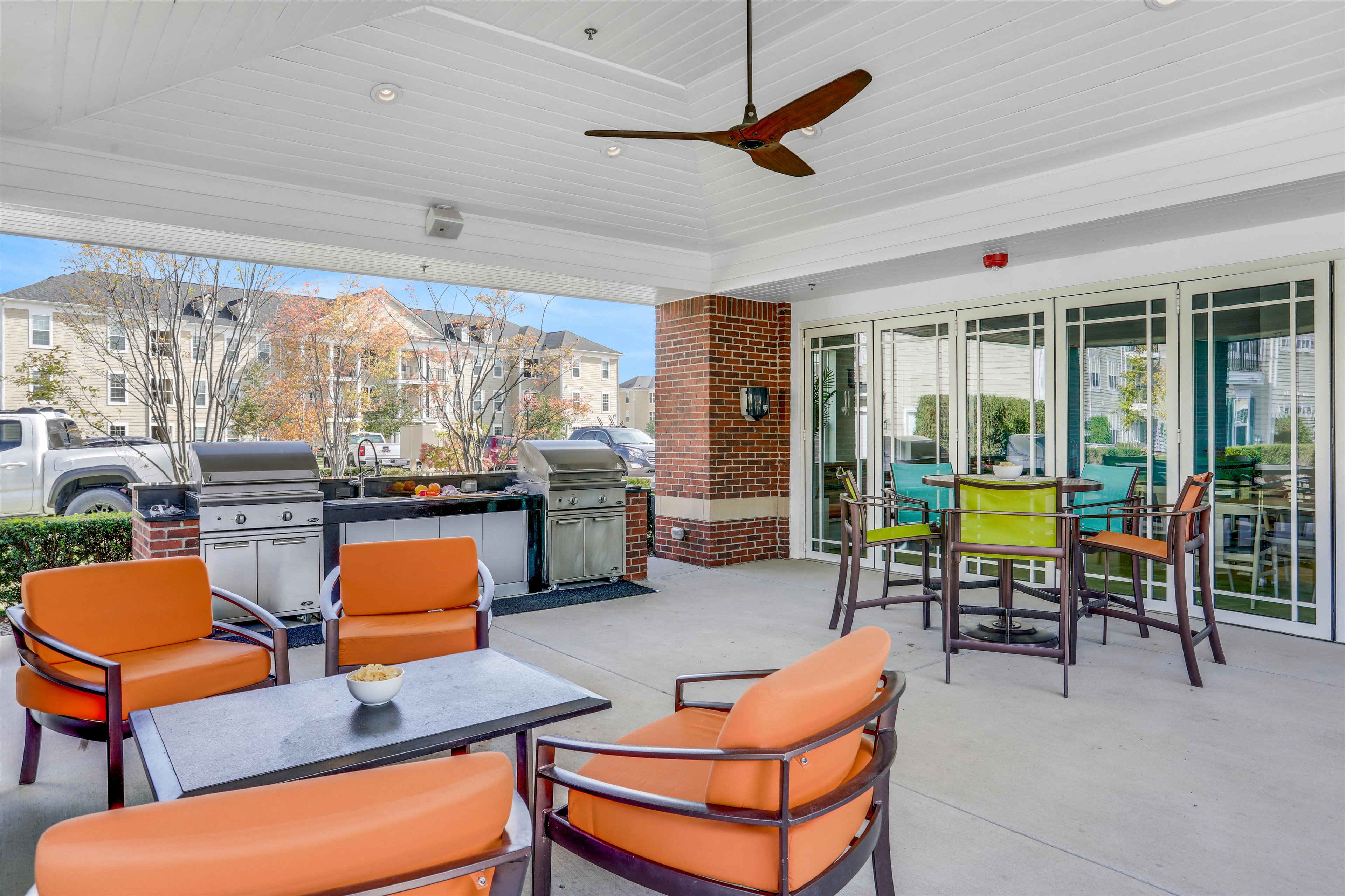 the porch has a seating area with chairs and tables