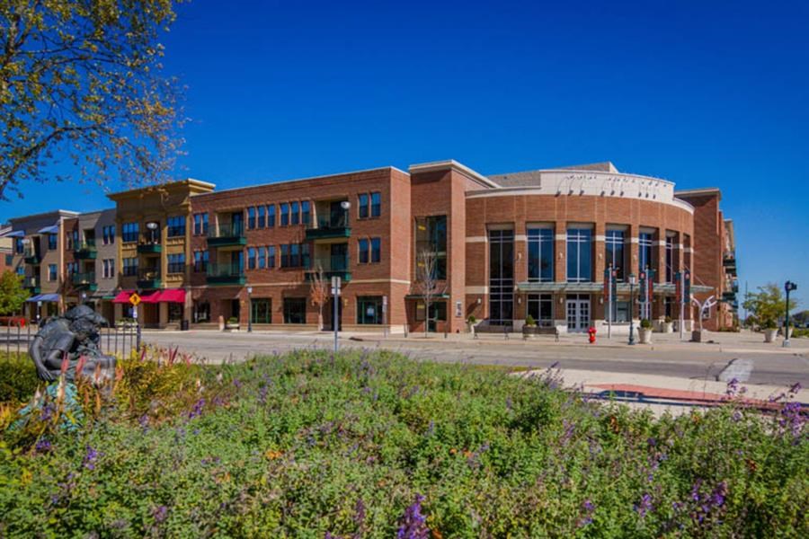 a large brick building on the side of a street