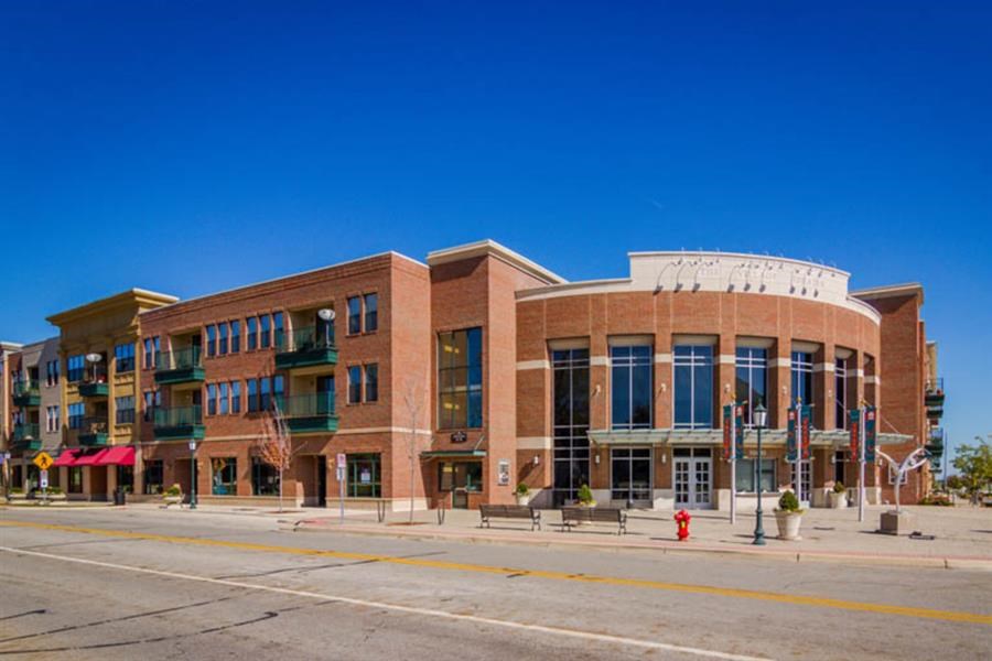 a large brick building on the side of a street
