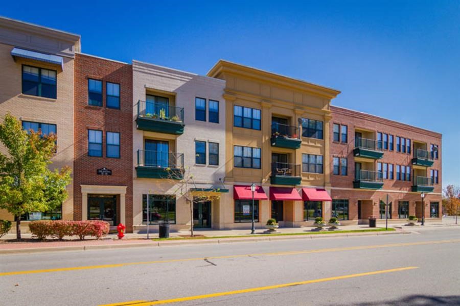 a row of buildings on the side of a street