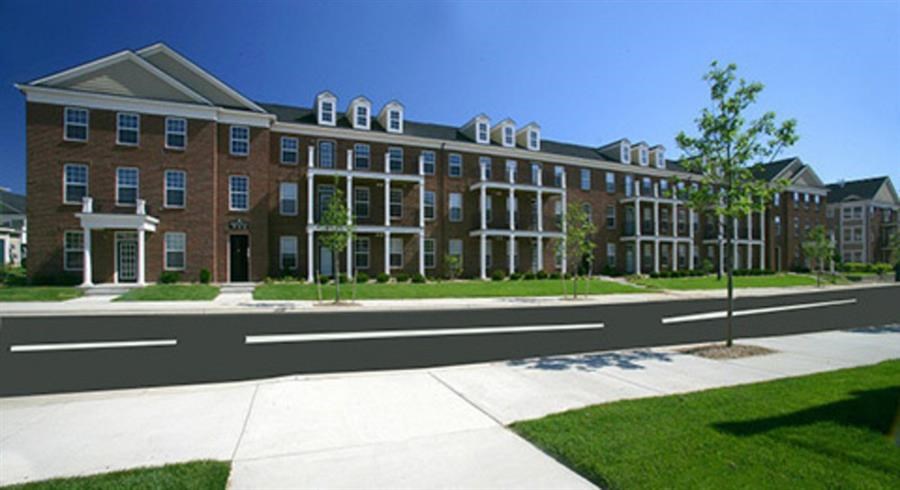 an architectural rendering of a large brick building with a sidewalk