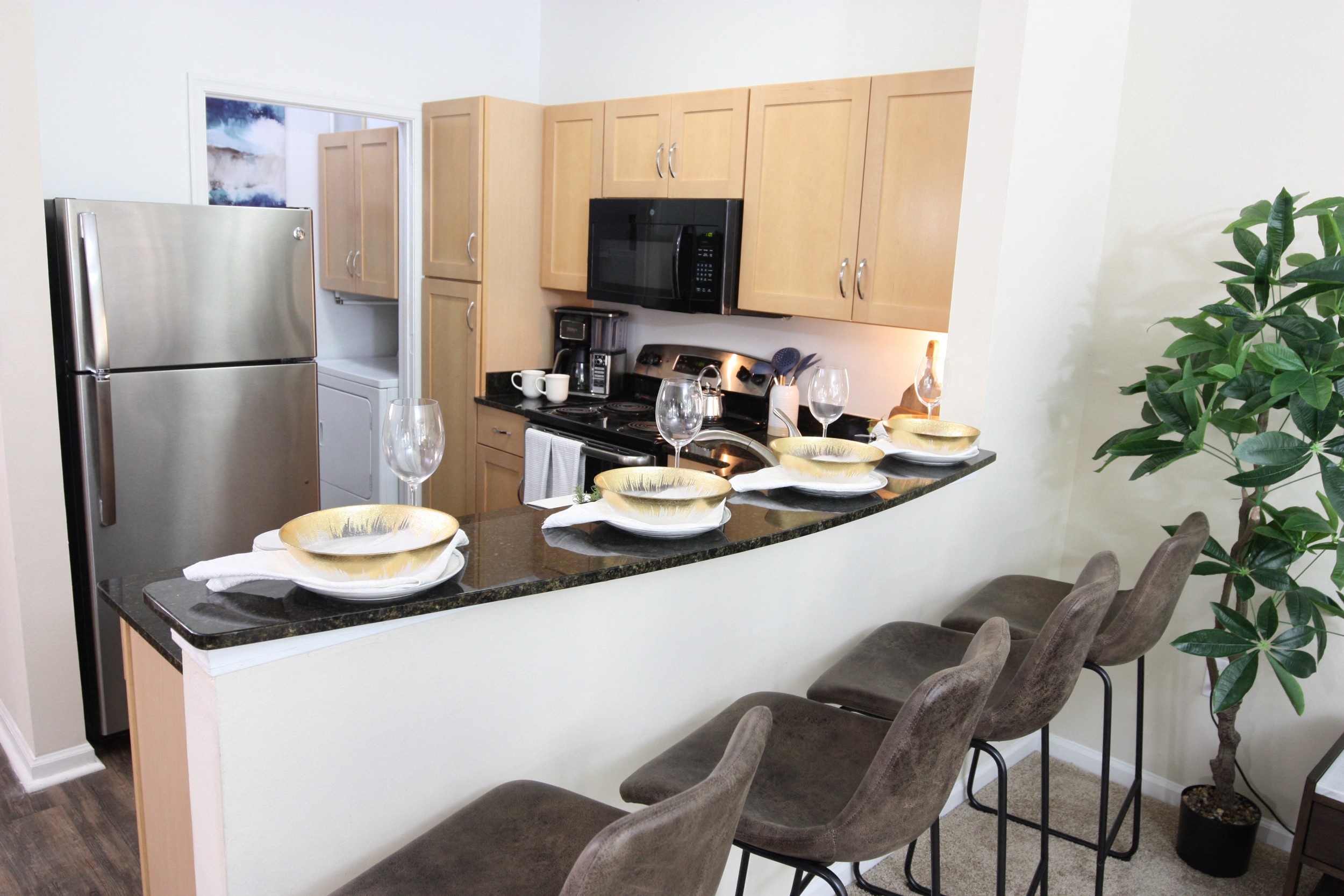 View of the kitchen in the model home at Harbour Breeze Apartments in Suffolk Virginia