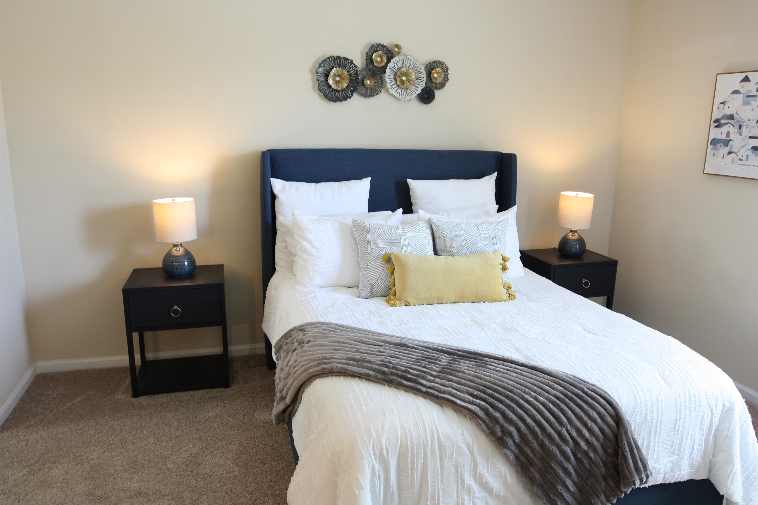 View of the bedroom in the model home at Harbour Breeze Apartments in Suffolk Virginia